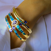 2 Oval Cut Tanzanite Stones and Australian Opal 14K Yellow Gold Plated Silver Bangle