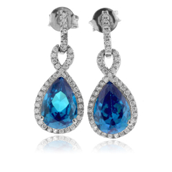 Elegantes Aretes con Topacio Azul en Plata de Ley .925